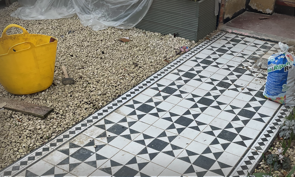 Landscaping black and white tiled path